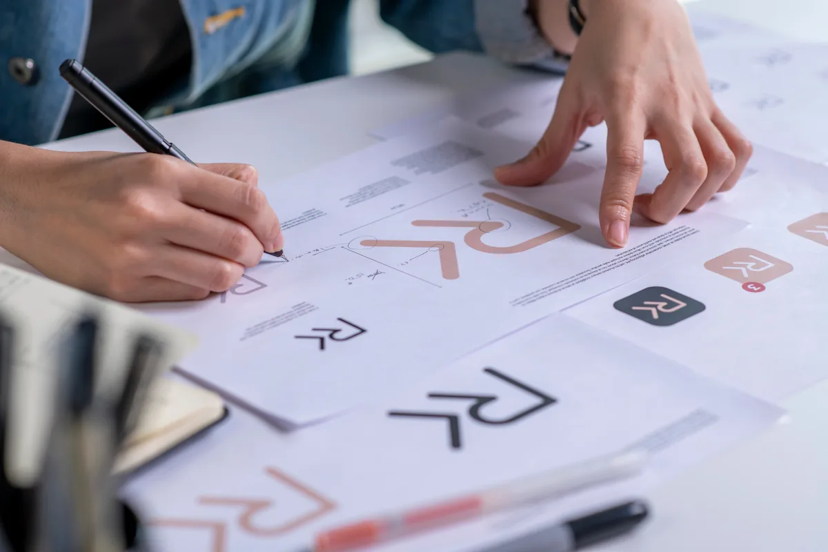 Cohesive restaurant brand identity system showing menu, signage, coasters, and packaging designed as one unified system