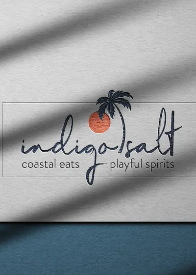 The Indigo Salt wordmark printed on paper in raking light